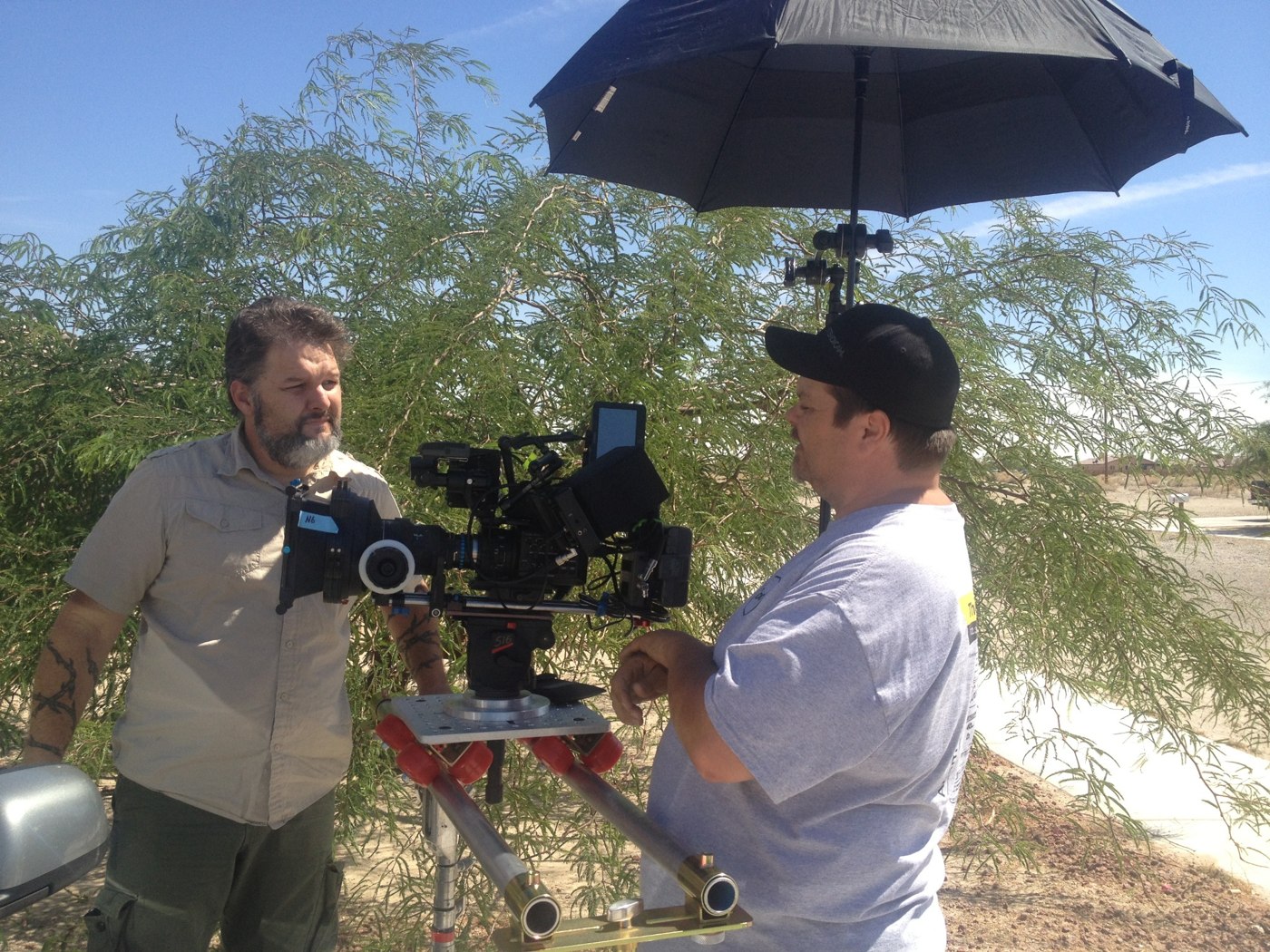 Britt Griffith working alongside a camera operator on location