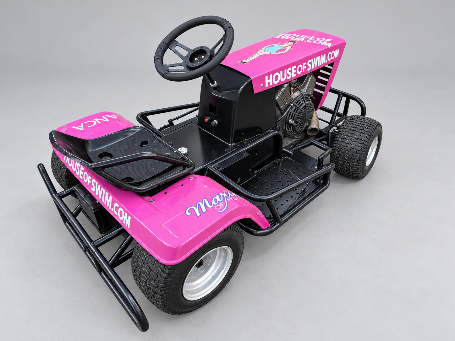 Pink racing mower — studio reference showing bodywork, seating and wheels