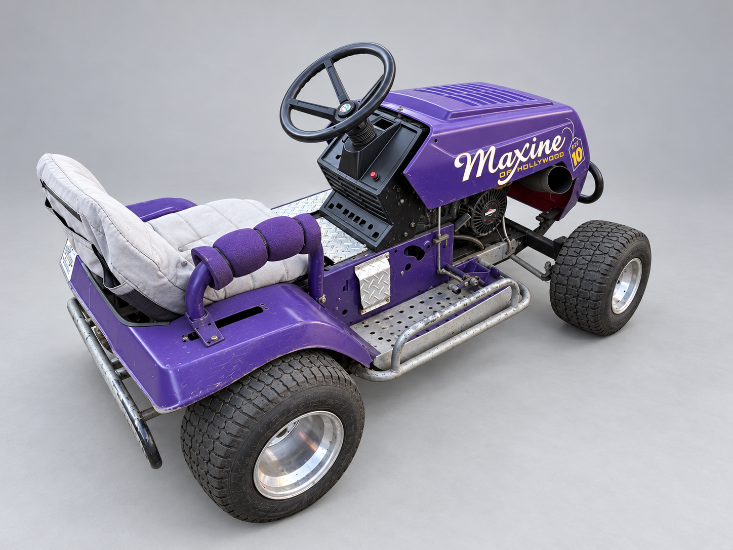 Purple racing mower — studio reference showing bodywork, seating and wheels